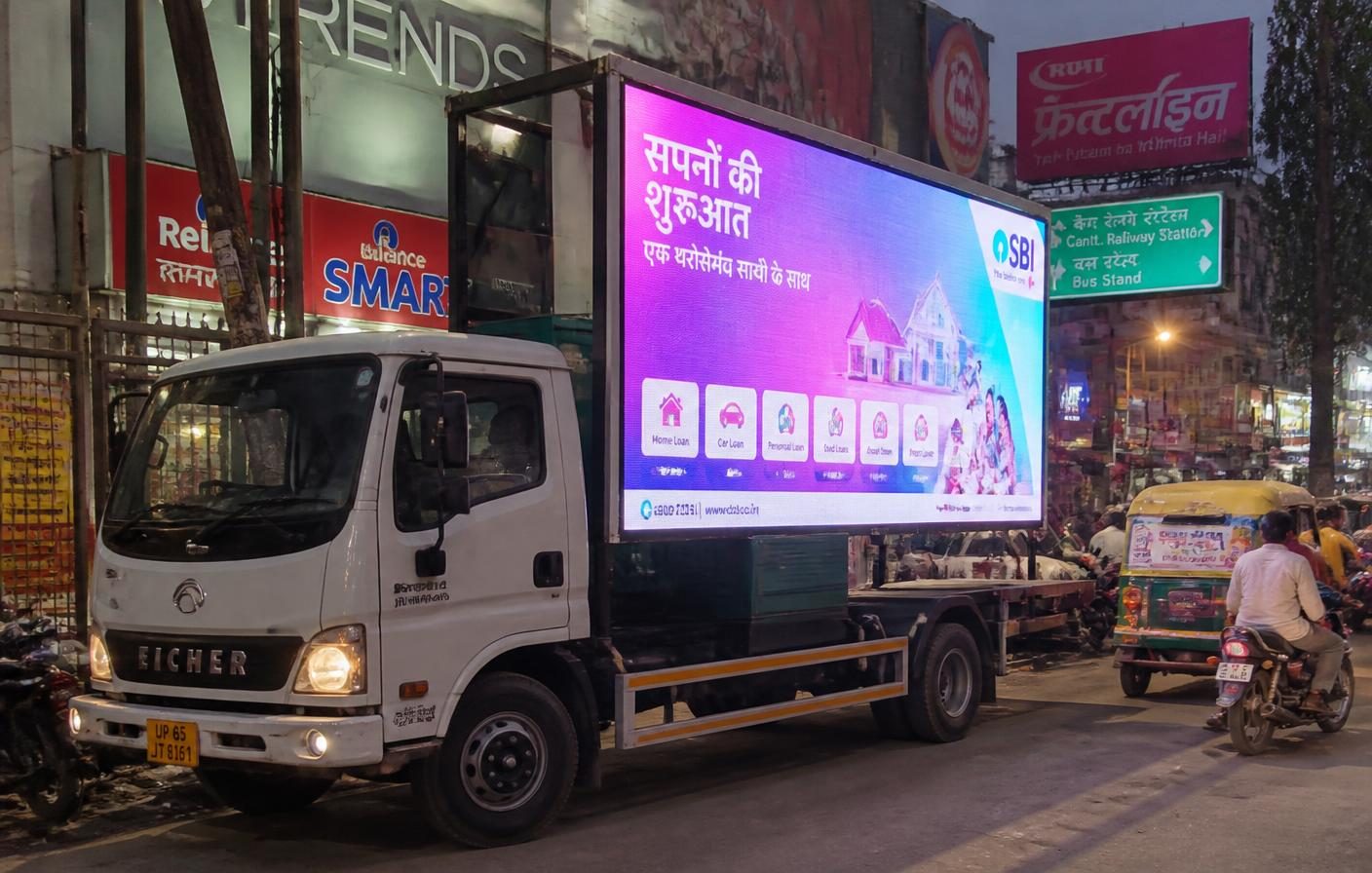 LED advertising truck running fintech creative on an Indian city street